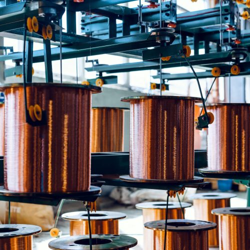 Production of copper wire, cable in reels at factory. Cable factory. Close up.
